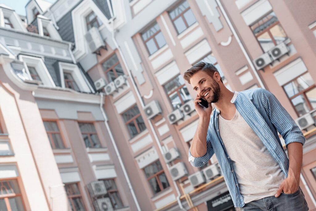 Communication - is the key to personal and career success. Smiling brown-haired man with blue eyes